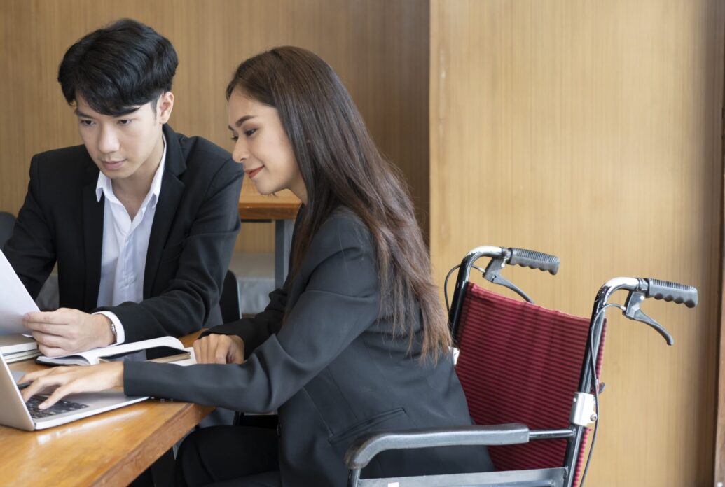 handicapped-woman-in-wheelchair-working-on-new-bus-2024-11-27-04-30-03-utc